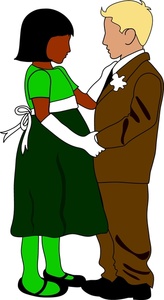 little boy and girl dancing at a formal dance while all dressed up in suit and dress